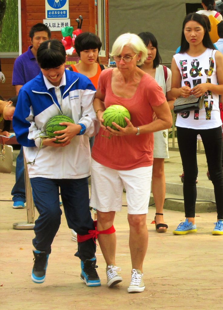 KL English literature teacher Lisa Ritter pairs up with a student for a three-legged race