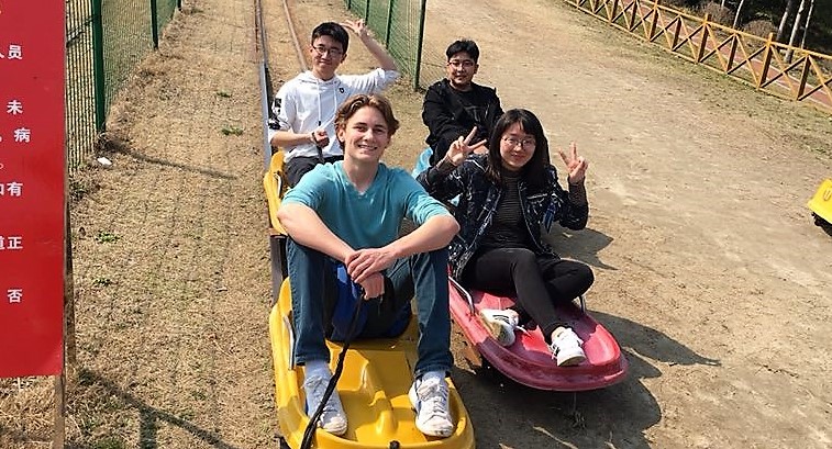 Exchange student Sam Guyer shopping in Natong with host family and friends