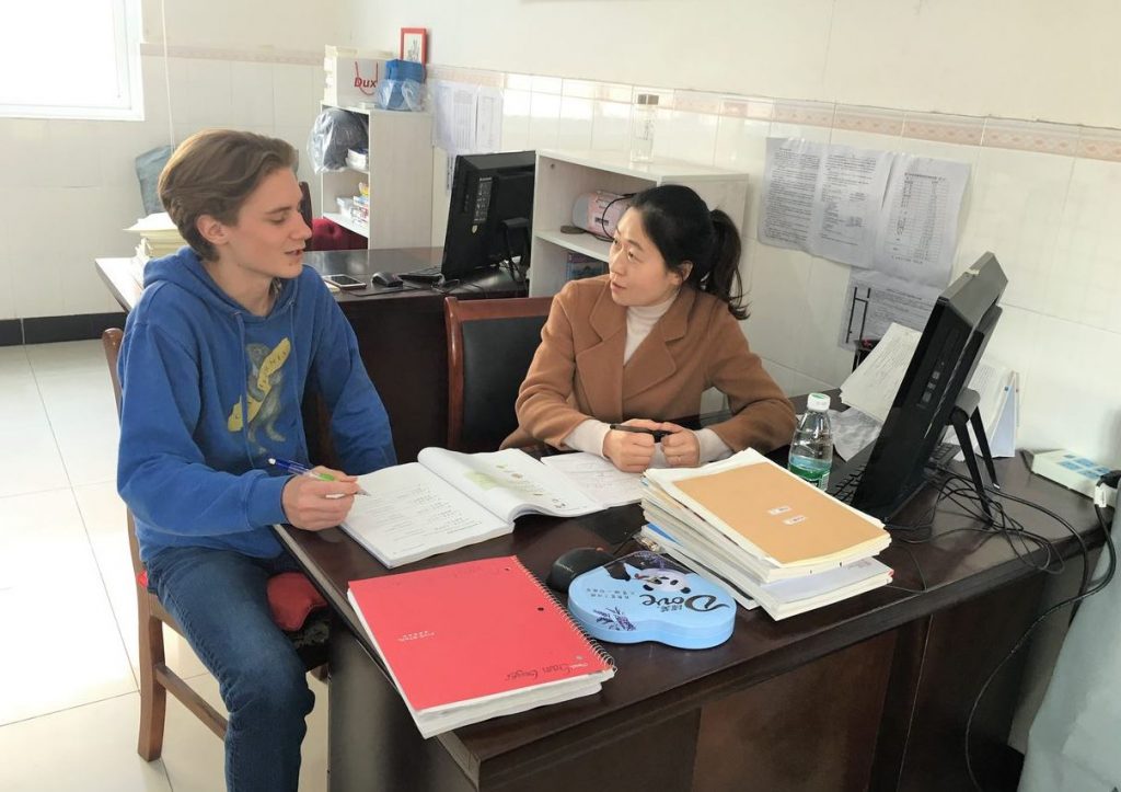 Exchange student Sam Guyer with Chinese teacher Ms. Piao